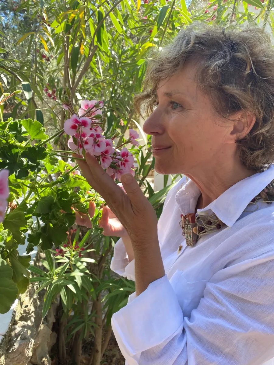 Branka Androjna holding pink flowers in the garden