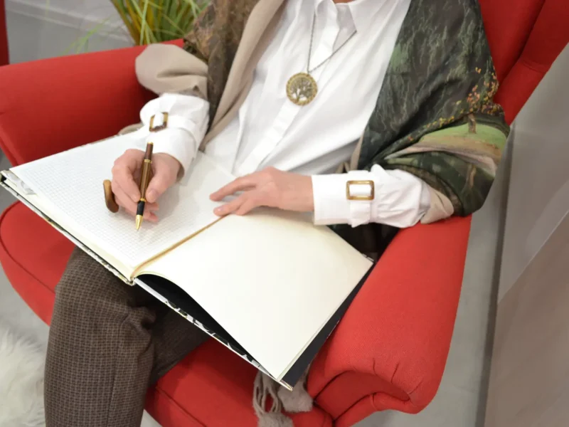 Milangela taking notes during a guidance and presence session
