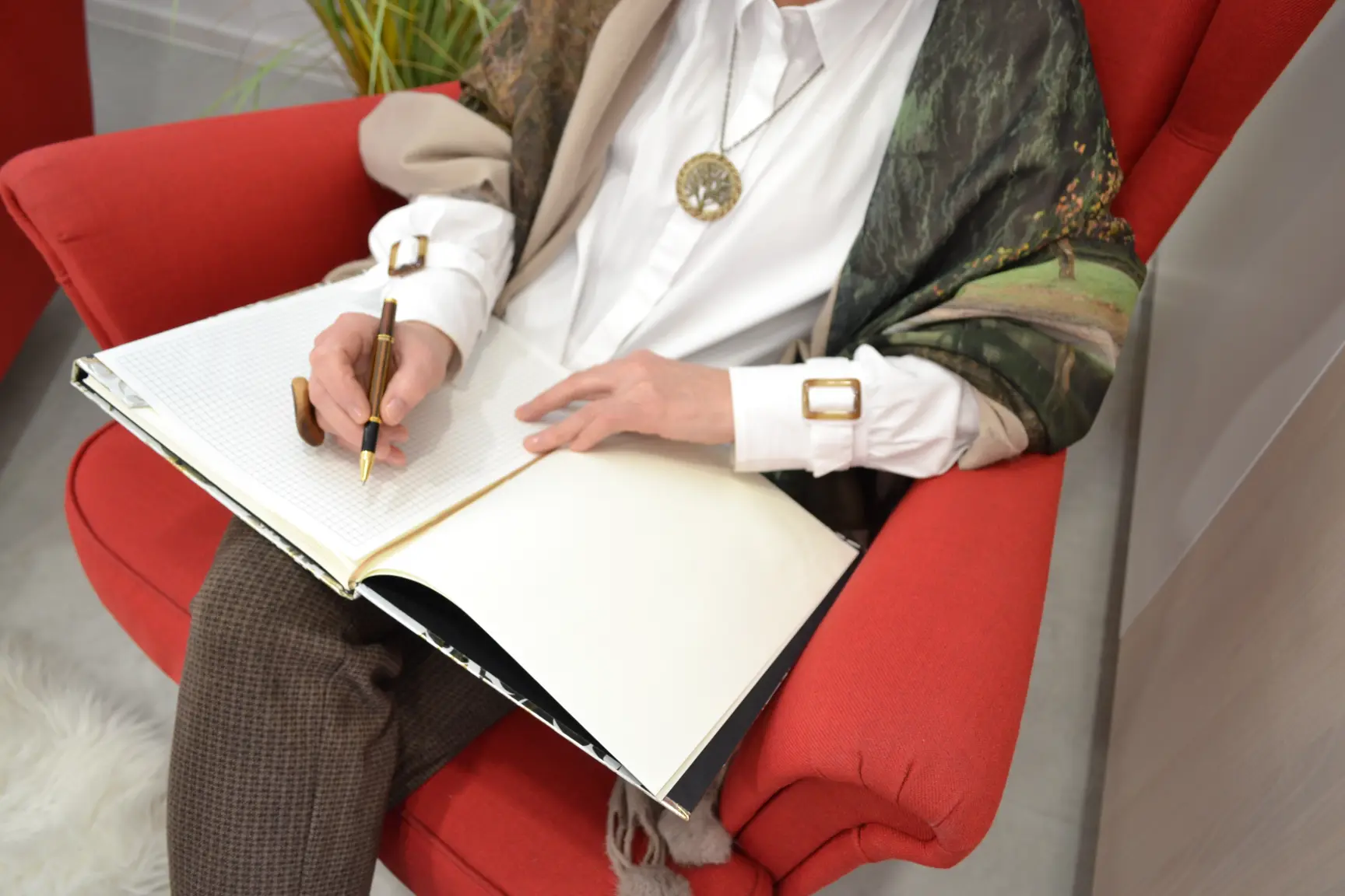 Milangela taking notes during a guidance and presence session